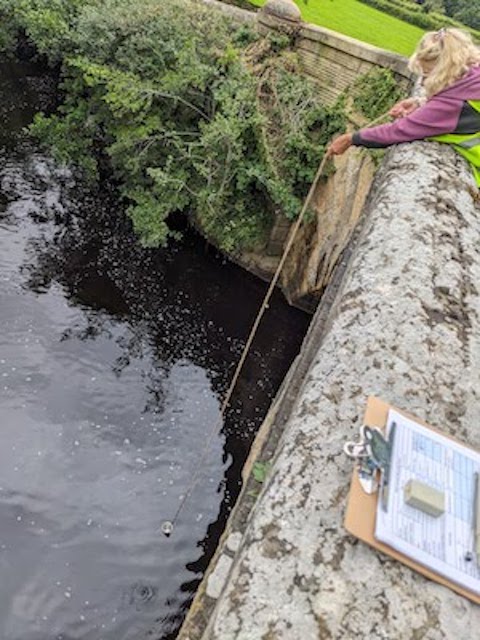 Ramsgill Nidd Bridge. Ramsgill Nidd Bridge. Karen sampling from downstream side of this stone bridge over the Nidd, into deep slow flowing water.
