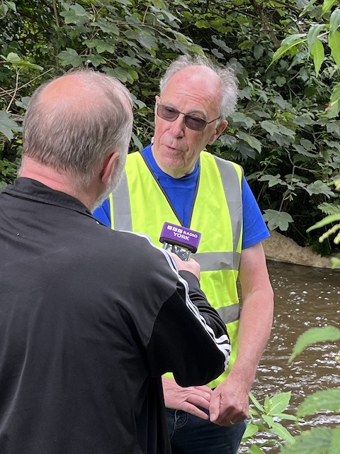 Crimple Beck, Burnbridge. NAG team 9 - David Amanda, Andy and Helen. David being interviewed by Jim from Radio York. A field drain noted.