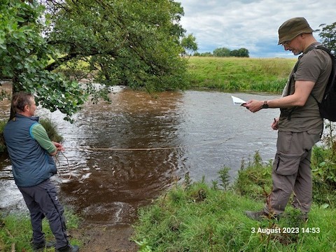 Little Ribston. Team 10 Martin and James sampling in a fast-flowing muddy river (photo by Judi)